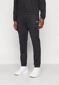 Jack & Jones Performance JPSTGORDON JJBASIC ICE CARGO PANTS - Hlače - black
