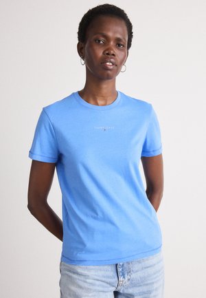 Light blue cotton t-shirt with a round neckline and short sleeves. Features a small white "TOMMY JEANS" logo on the chest.