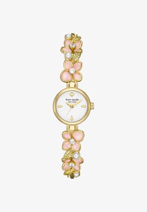 Montre dorée avec cadran blanc, aiguilles dorées, ornée de pétales de fleurs roses, de perles et d'accents en cristal sur le bracelet.