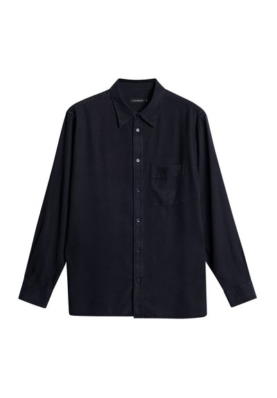 Navy blue long-sleeve shirt made of cotton, featuring a button-up front, collar, and a single chest pocket on the left side.