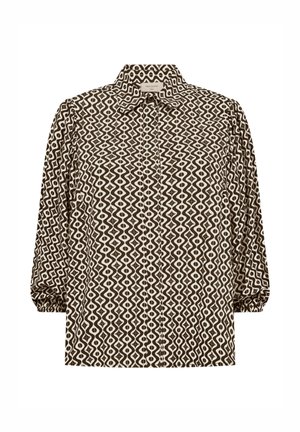 Blouse met lange mouwen met zwart-wit geometrisch golfpatroon, knoopsluiting aan de voorkant en elastische manchetten aan de mouwen.