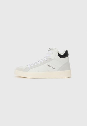 High-top sneakers in white leather with gray suede accents and a black heel. Features white laces and a rubber sole with branding.
