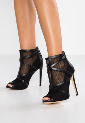 Bottines à talons hauts - black