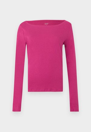 Rosa långärmad tröja med båthalsning. Tillverkad av mjukt, stretchigt bomullsmaterial. Har en figurnära silhuett och en minimalistisk design.