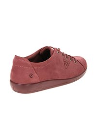 Red suede sneaker with a rounded toe, lace-up design, and logo detail. Features a flexible rubber sole and smooth inner lining.