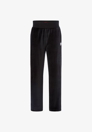 Czarne spodnie z weluru z elastycznym paskiem w talii i małą białą naszywką z logo "HUGO" na górnej lewej udzie.