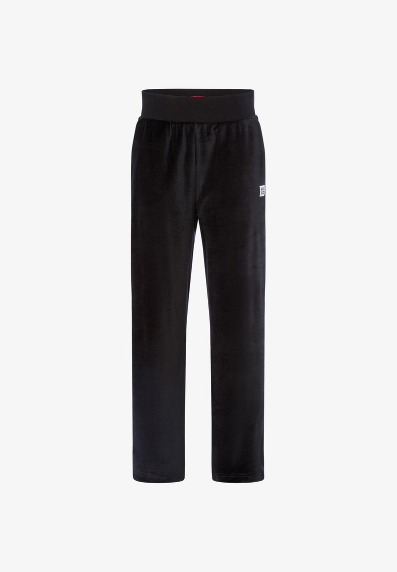 Schwarze Velours-Hosen mit elastischem Bund und kleinem weißen "HUGO"-Logo-Patch am oberen linken Oberschenkel.