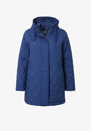 Sininen tikattu parka-takki, jossa on huppu, viistoja ompeleita, säädettävät nyörit ja etuvetoketju.
