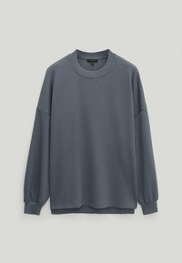 Gray long-sleeve sweatshirt with a round neckline, dropped shoulders, and elastic cuffs; made of soft, textured fabric.