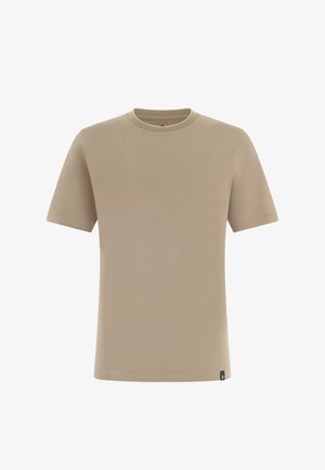 T-shirt beige à manches courtes et col rond avec une petite étiquette noire sur l'ourlet inférieur, sur fond blanc.