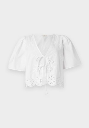 Balta trumpa bluzelė su pūstomis rankovėmis, V formos iškirpte, priekyje surišama, ir banguotu apvadu su akies siuvinėjimu palei kraštą.