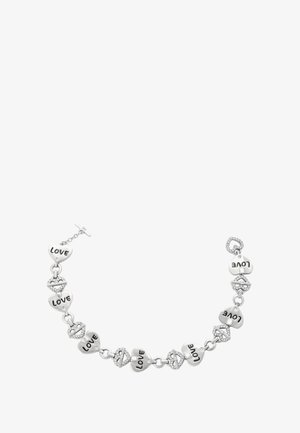 Brățară argintie cu lanțuri alternante în formă de inimă gravate cu "DRAGOSTE" și buze împodobite cu strasuri, având un închizător tip toggle.