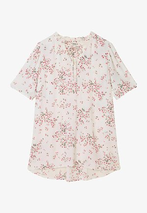 Weiße kurzärmlige Bluse mit Schlüssellochausschnitt, verziert mit einem floralen Muster aus roten und grünen Blättern auf einem strukturierten Stoff.