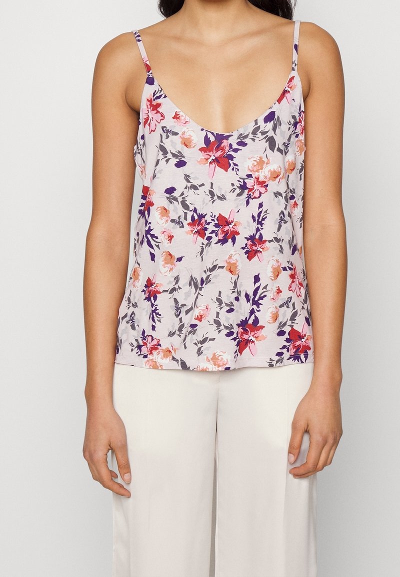 Floral camisole in lightweight fabric, featuring a scoop neckline, thin straps, and a mix of purple, orange, and pink flowers on a pale background.