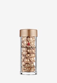 Elizabeth Arden Vitamin C Ceramide-kapslar i en genomskinlig behållare med ett guldlock, som innehåller gyllene, kupolformade kapslar inuti.