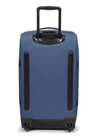 Blue hard-shell suitcase with a telescopic handle. Features black accents and wheels, textured surface, sturdy base with protective feet.