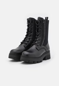 Calvin Klein Jeans CHUNKY COMBAT LACEUP ZIP - Botines con plataforma - black