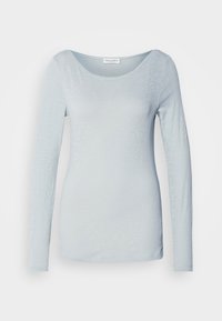 Šviesiai mėlyna, ilgarankovė palaidinė, pagaminta iš lengvos, tekstūruotos medžiagos, su plačiu iškerpimu ir prigludusia forma. Minimalistinis dizainas be raštų.