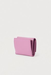 Compact pink textured leather wallet with multiple folds and a flap closure, displayed against a plain light background.
