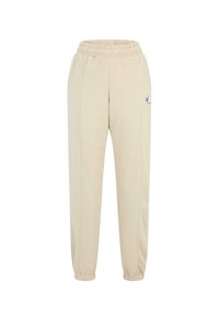 Beige Jogginghosen verfügen über einen elastischen Bund, zulaufende Knöchel, seitliche Nähte und ein kleines lila Logo am linken Hüftbereich.