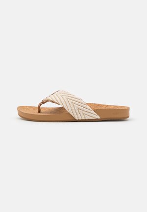 Chinelo com sola de cortiça castanha e tira trançada branca, apresentando um padrão chevron e um design simples. Construção flexível e leve.