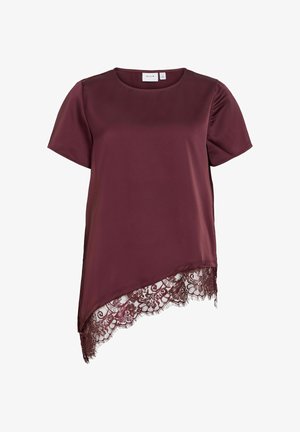 Lyhythihainen, tummanvioletti pusero, jossa epäsymmetrinen helma ja yksityiskohtainen kukkakuvioinen pitsireunus alareunassa.