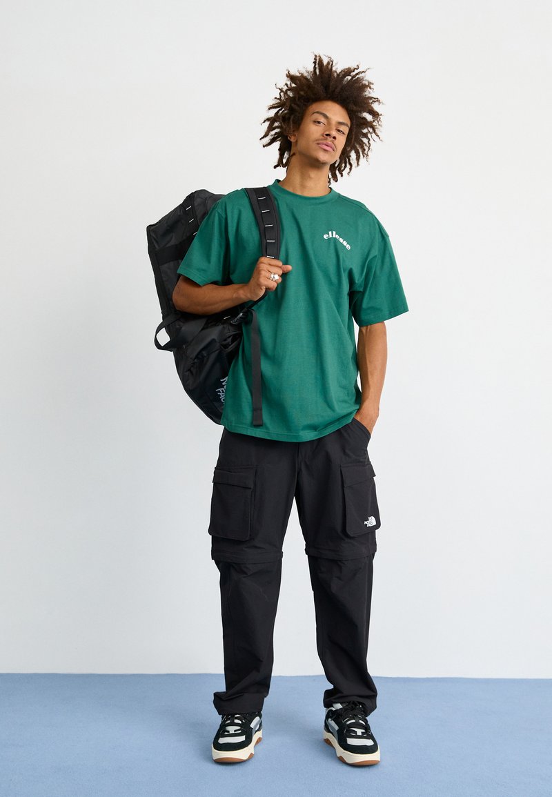 The North Face BASE CAMP VOYAGER DUFFEL 62L UNISEX - Borsa per lo sport - black/white