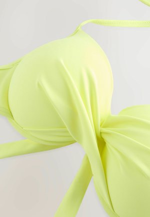 Jasně neonově žlutý vršek bikiny s hladkým povrchem, který má nastavitelné ramínka a uzlový detail uprostřed.