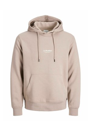 Beige cotton hoodie with a front pocket, drawstring hood, ribbed cuffs, and logo text "JJ Studios" in white across the chest.