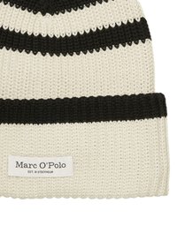 Cream and black striped knitted beanie with a thick ribbed cuff and a tag featuring "Marc O'Polo, EST. IN STOCKHOLM."