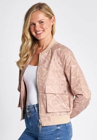 Light pink bomber jacket with abstract pattern, front zipper, and side pocket, made from soft material, featuring ribbed cuffs and hem.