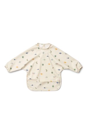 Long-sleeve, cream bib with colorful print of airplanes, birds, and hot air balloons. Elastic cuffs and a pocket at the bottom for spills.
