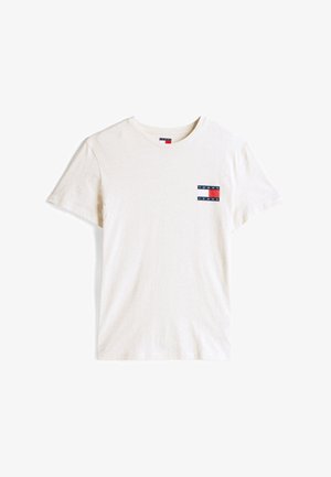 Kortermet, kremfarget T-skjorte laget av bomull. Har en liten rektangulær logo på brystet i marine, rød og hvit.