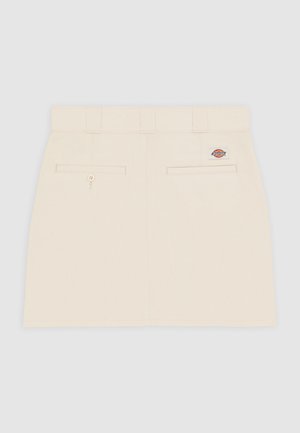 Beżowa bawełniana spódnica o prostym kroju, z szlufkami na pasek i dwiema tylnymi kieszeniami. Posiada małą metkę z logo po prawej stronie.