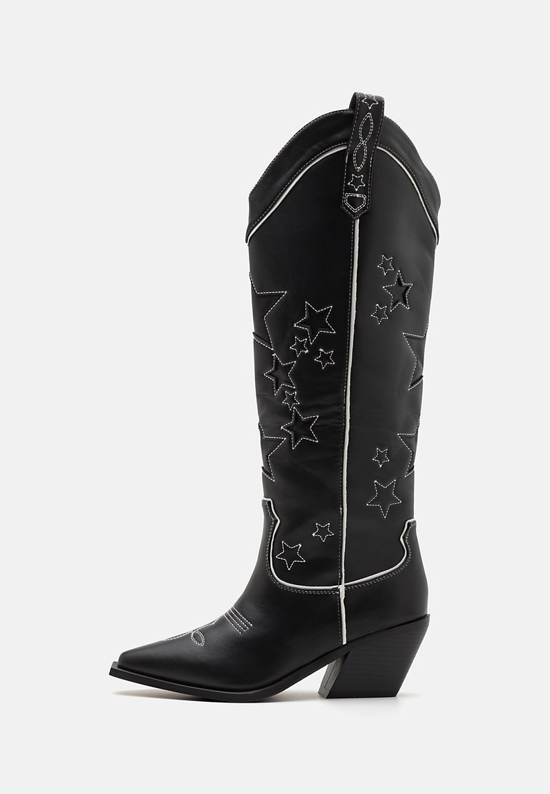 Black cowboy boots with pointed toes, a chunky heel, and star patterns stitched in white along the shaft. Soft leather material.