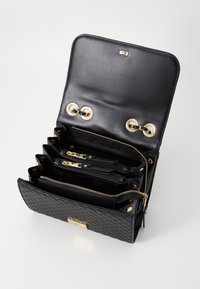 Steve Madden BCALA - Axelremsväska - black/gold-coloured