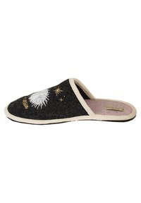 Black felt slipper with beige trim, featuring white and gold star embroidery. Open back design, soft interior lining, and textured sole.