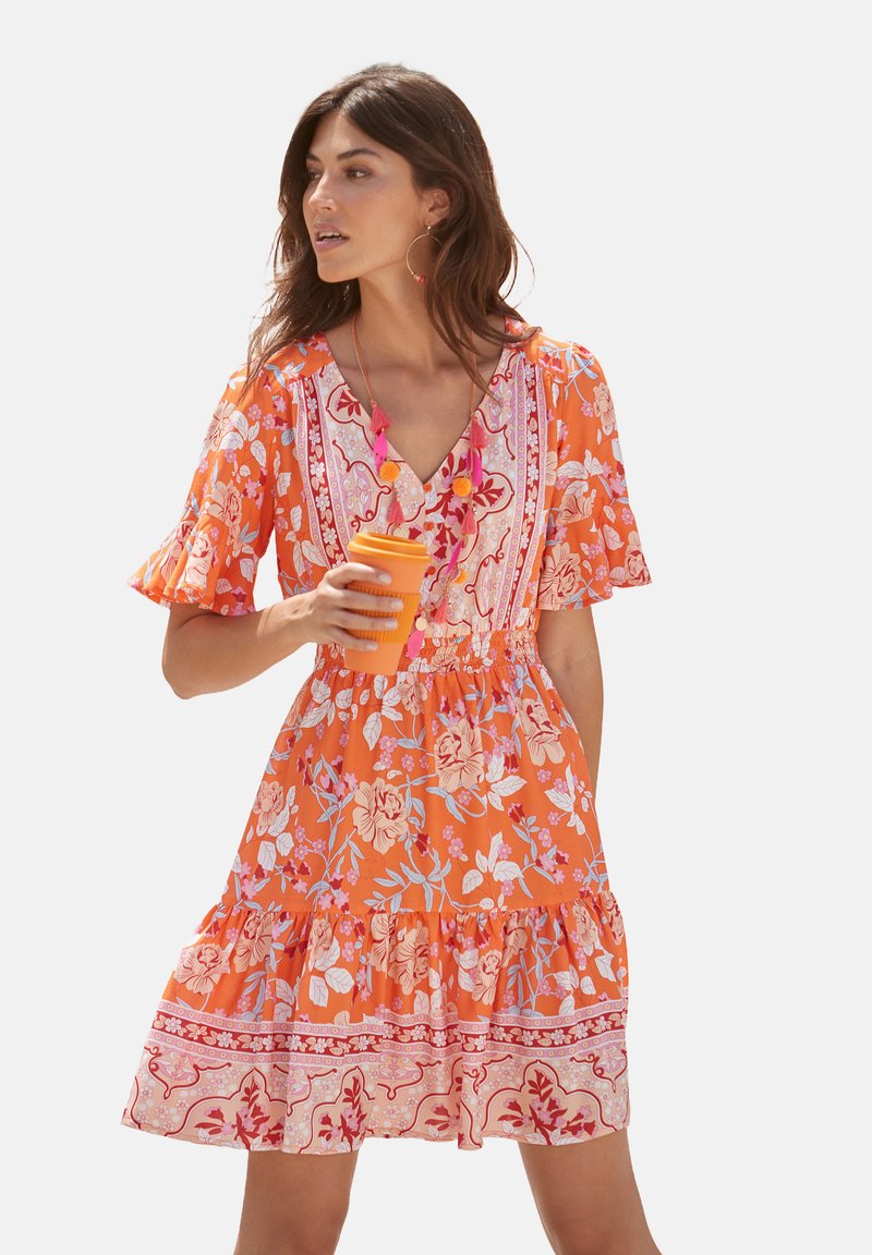 Orange floral dress with short ruffled sleeves, V-neckline, and tiered skirt. Features pink floral patterns and a cinched waist.