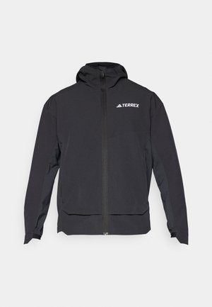 Veste Terrex noire avec fermeture éclair à l'avant, capuche et logo en haut à gauche. Elle présente un design élégant et une texture lisse.
