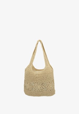 Borsa a tracolla beige all'uncinetto con motivo floreale traforato e fodera in tessuto solido, caratterizzata da una tracolla larga e una forma rettangolare.