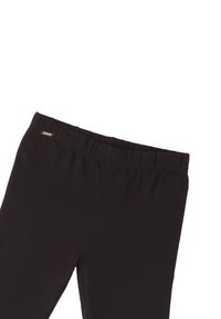 Leggings noirs avec une taille élastique, présentant une texture lisse et une petite étiquette métallique près de la taille.