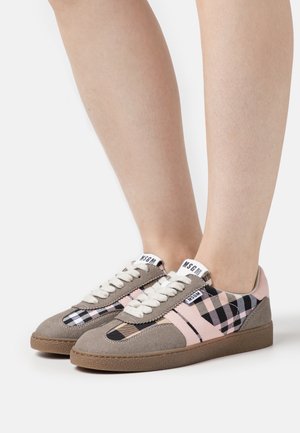 Gray and pink sneakers with a checkered pattern, textured suede material, white laces, and a brown rubber sole. Brand label visible on tongue.