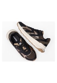Black and beige athletic sneakers with mesh and synthetic materials, textured accents, rubber soles, and lace-up design.