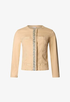 Béžová bunda s dlouhými rukávy, kulatým výstřihem a svislým řádkem stříbrných flitrů uprostřed vpředu.