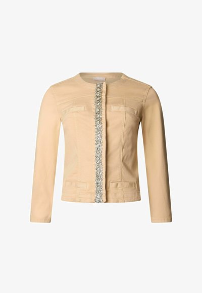 Veste beige à manches longues avec encolure ronde et rangée verticale de sequins argentés au centre devant.