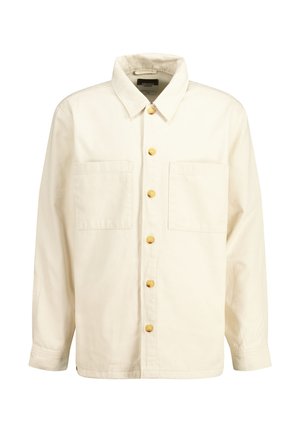 Light cream button-up shirt made of cotton with a collared neck, two chest pockets, and yellow buttons. The texture is smooth and slightly structured.