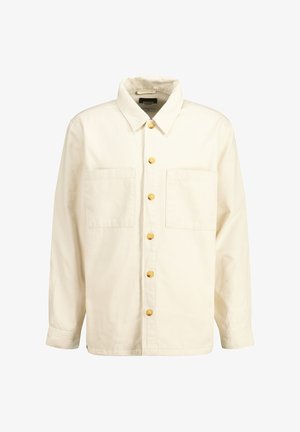 Light cream button-up shirt made of cotton with a collared neck, two chest pockets, and yellow buttons. The texture is smooth and slightly structured.