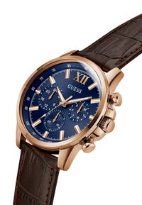Orologio in acciaio inossidabile rose gold con quadrante blu, sub-quadranti cronografi e cinturino in pelle marrone con finitura a coccodrillo.