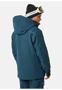 Türkiser Technik-Jacke mit Kapuze, aus strapazierfähigem Material, verstellbaren Bündchen und dem Markennamen "SWEDEMOUNT" auf den Schultern.