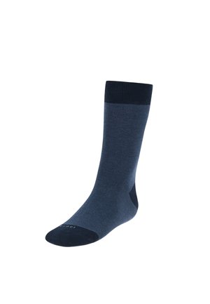 Dunkelblaue Socke aus glattem Material. Gerippter Rand, verstärkter Fersen- und Zehenbereich, tonal unterschiedliche Farbnuancen. Einfaches, funktionales Design.